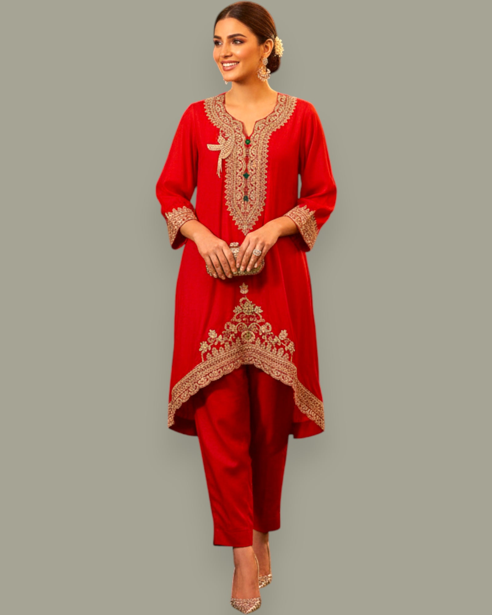 Woman wearing a red embroidered outfit on a gray background