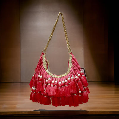Richly embellished statement Potli with a handcrafted-inspired aesthetic