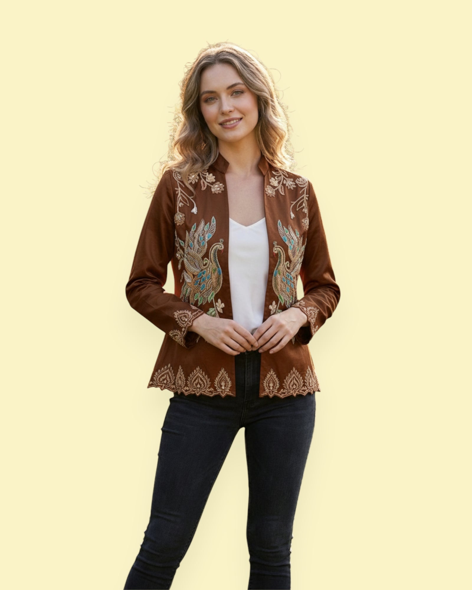 Woman wearing a brown embroidered jacket on a yellow background