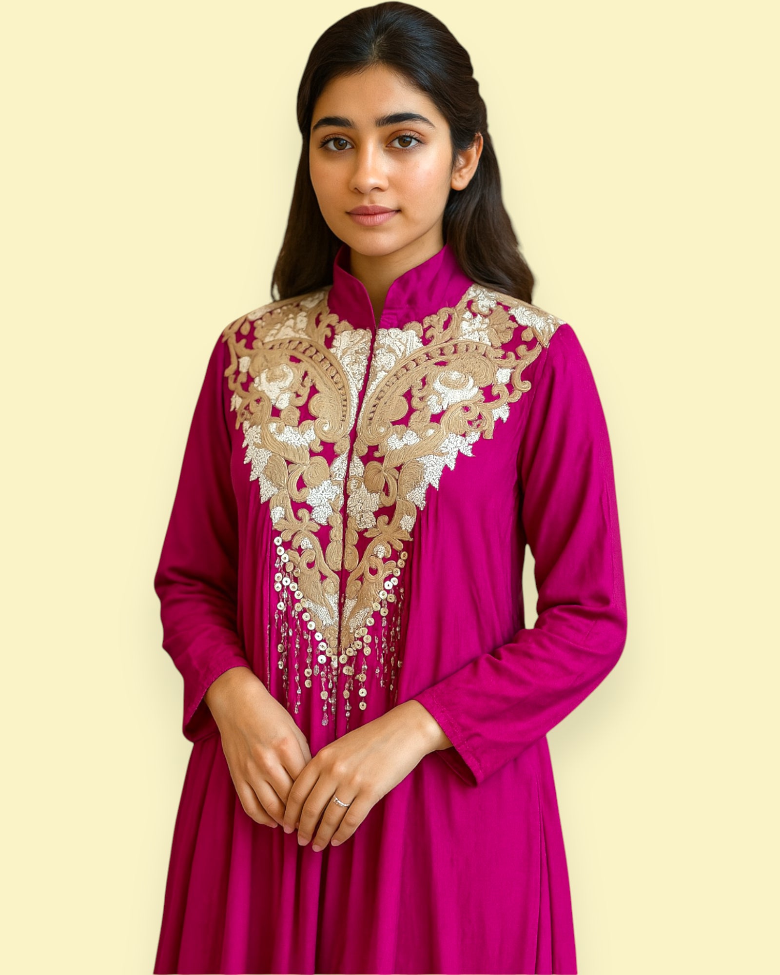 Woman wearing a Purple traditional outfit with gold embroidery on a beige background