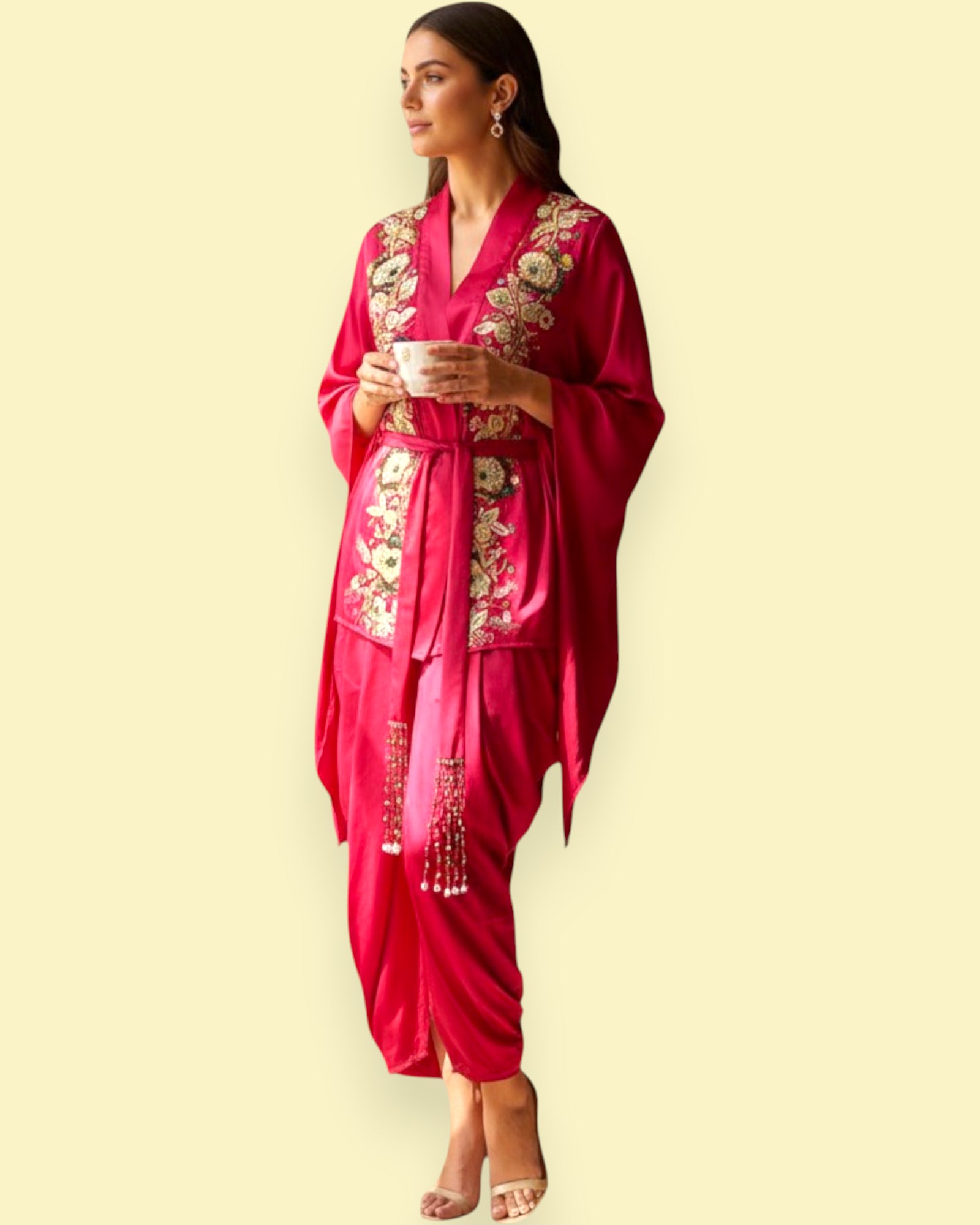 Woman wearing a Red traditional outfit with gold embroidery on a beige background