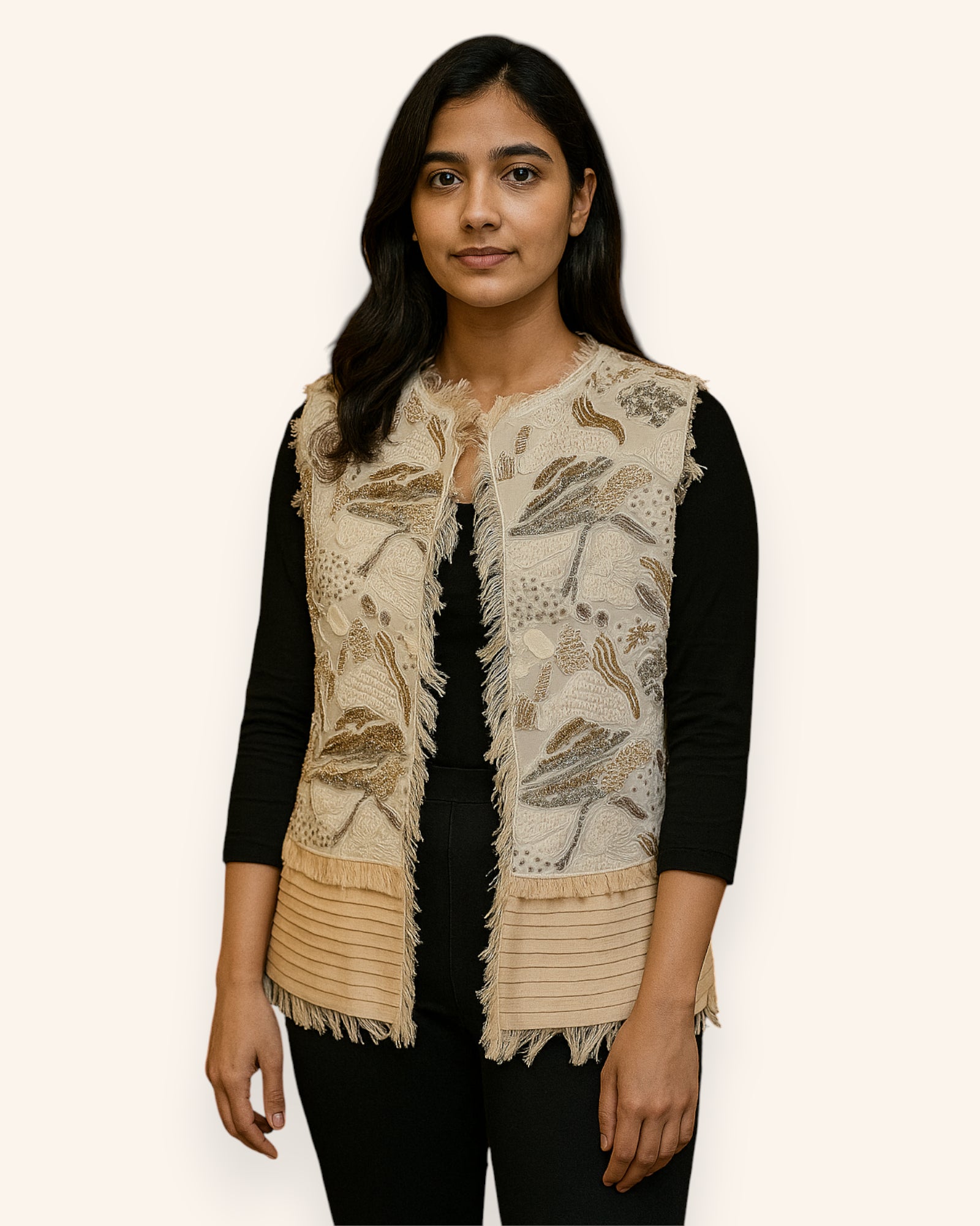 Woman wearing a Embroidery beige vest over a black top on a white background