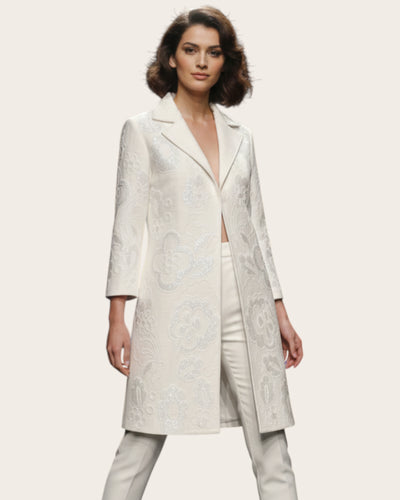 Woman wearing a white coat on a plain background