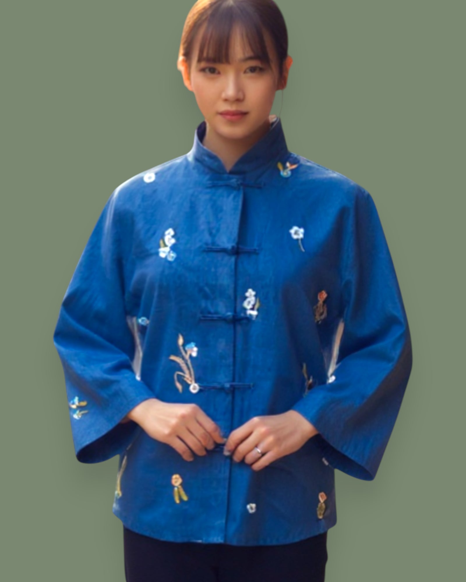 Woman wearing a blue embroidered jacket on a transparent background