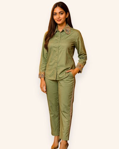 Woman wearing a green outfit with a white background