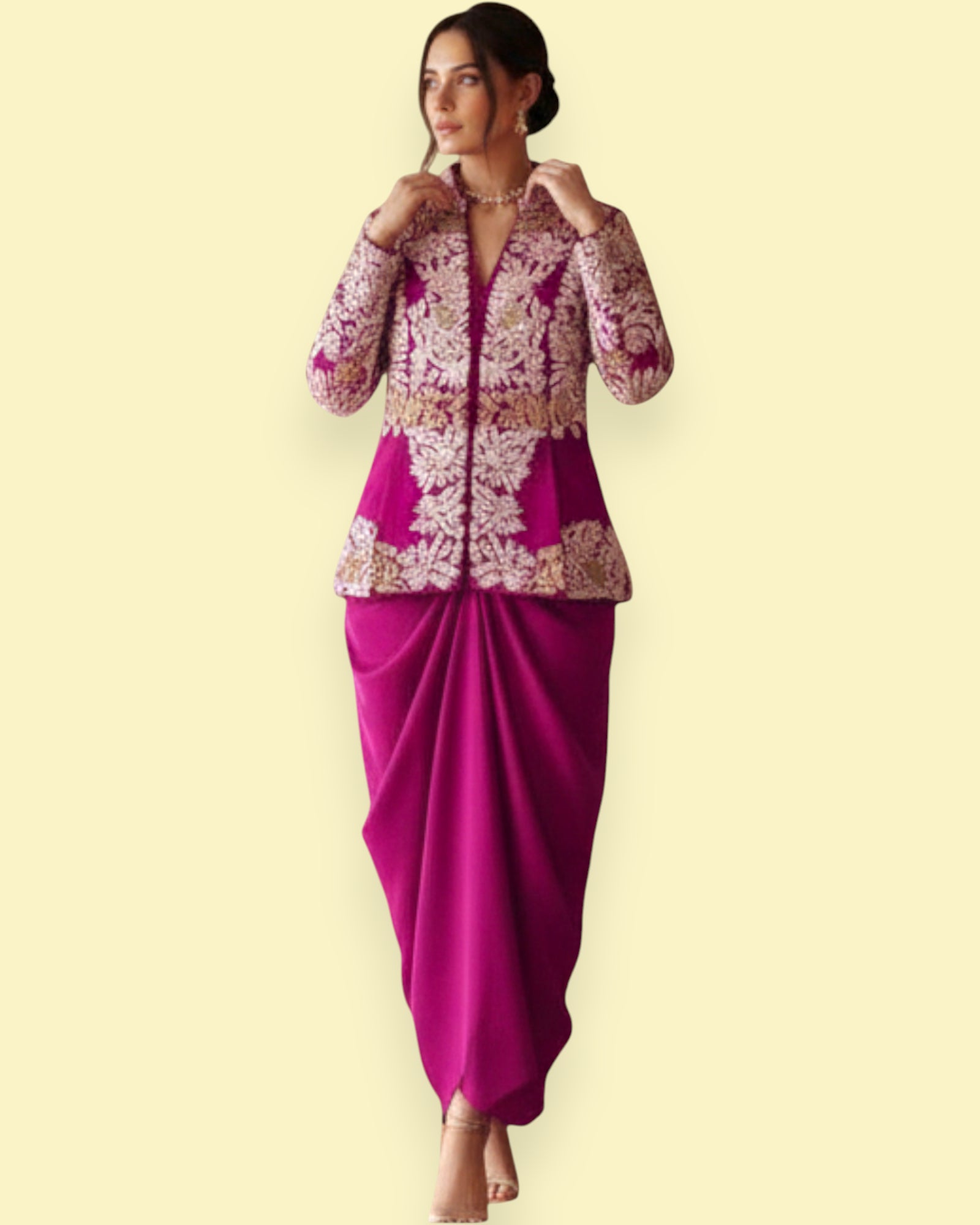 Woman wearing a pink and gold traditional outfit on a beige background
