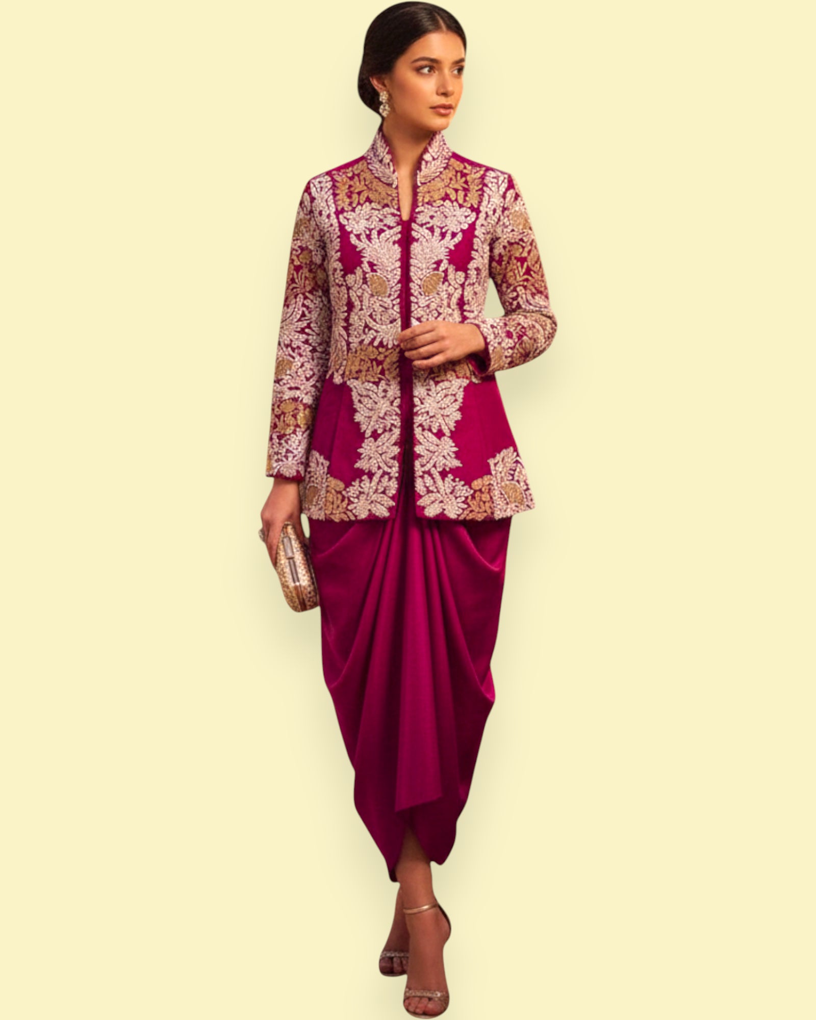 Woman wearing a traditional outfit with a Purple jacket and purple dhoti on a beige background